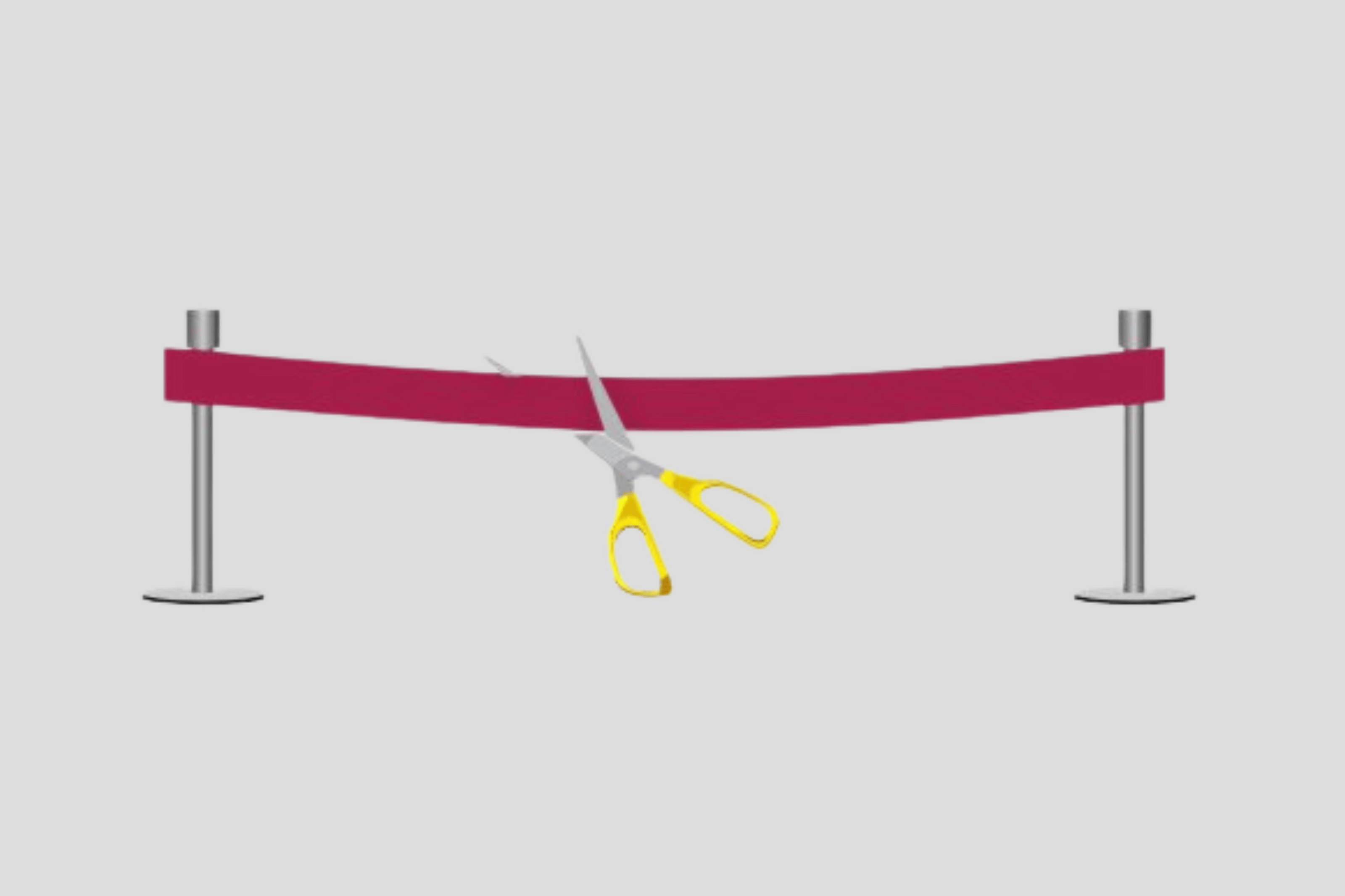 Saks klipper et rødt bånd på en grå bakgrunn.