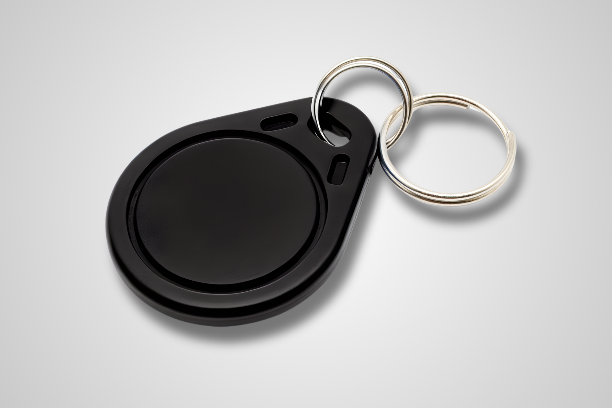 Et foto av NFC Nøkkelbrikke fra JM Band®. Kjøp RFID i Svart her.