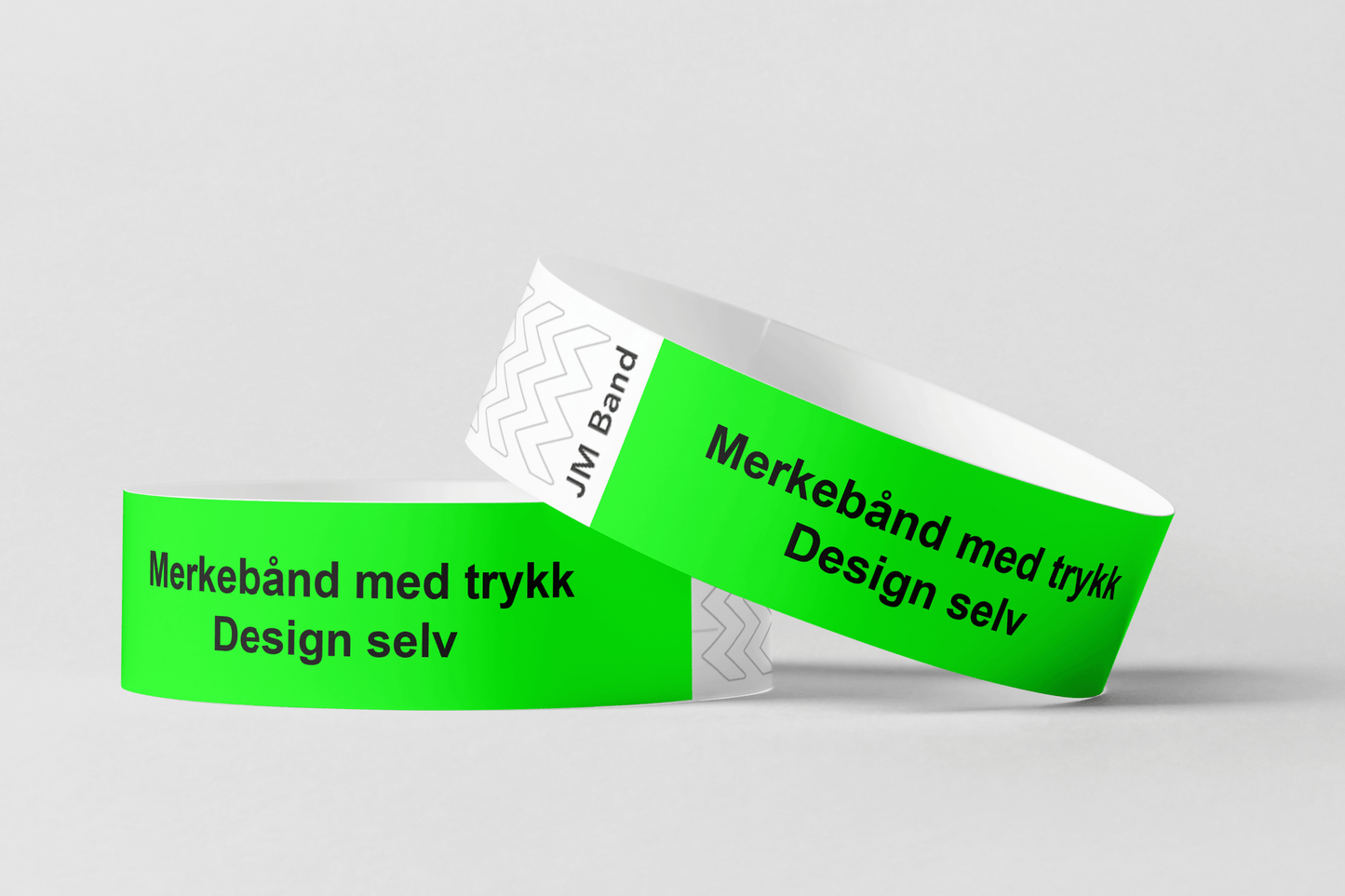 To grønne JM Band NO tyvek armbånd med ordene Merking av kassetttrykk Design selv.