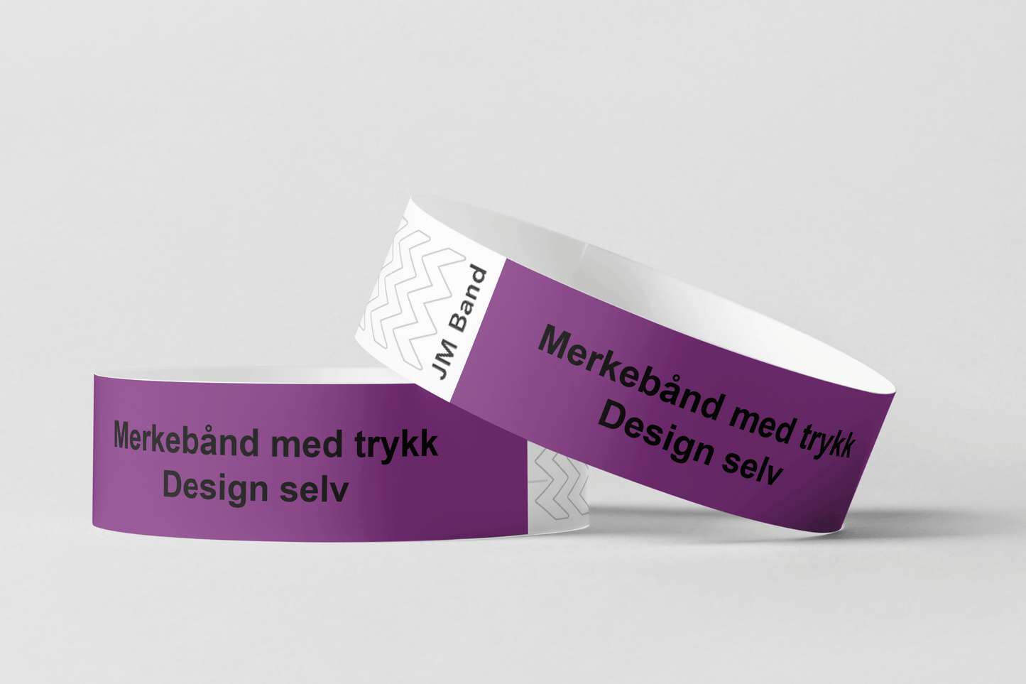 To lilla festivalarmbånd med ordene Merking av kassetttrykk Design selv fra JM Band NO.