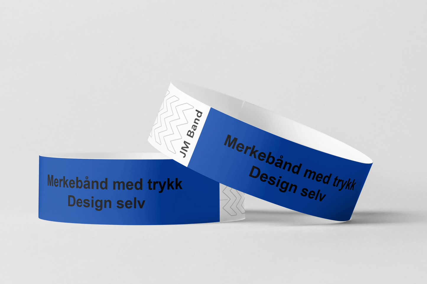 To blå JM Band NO tyvek armbånd uten trykk med ordene Merking av kassetttrykk Design selv.