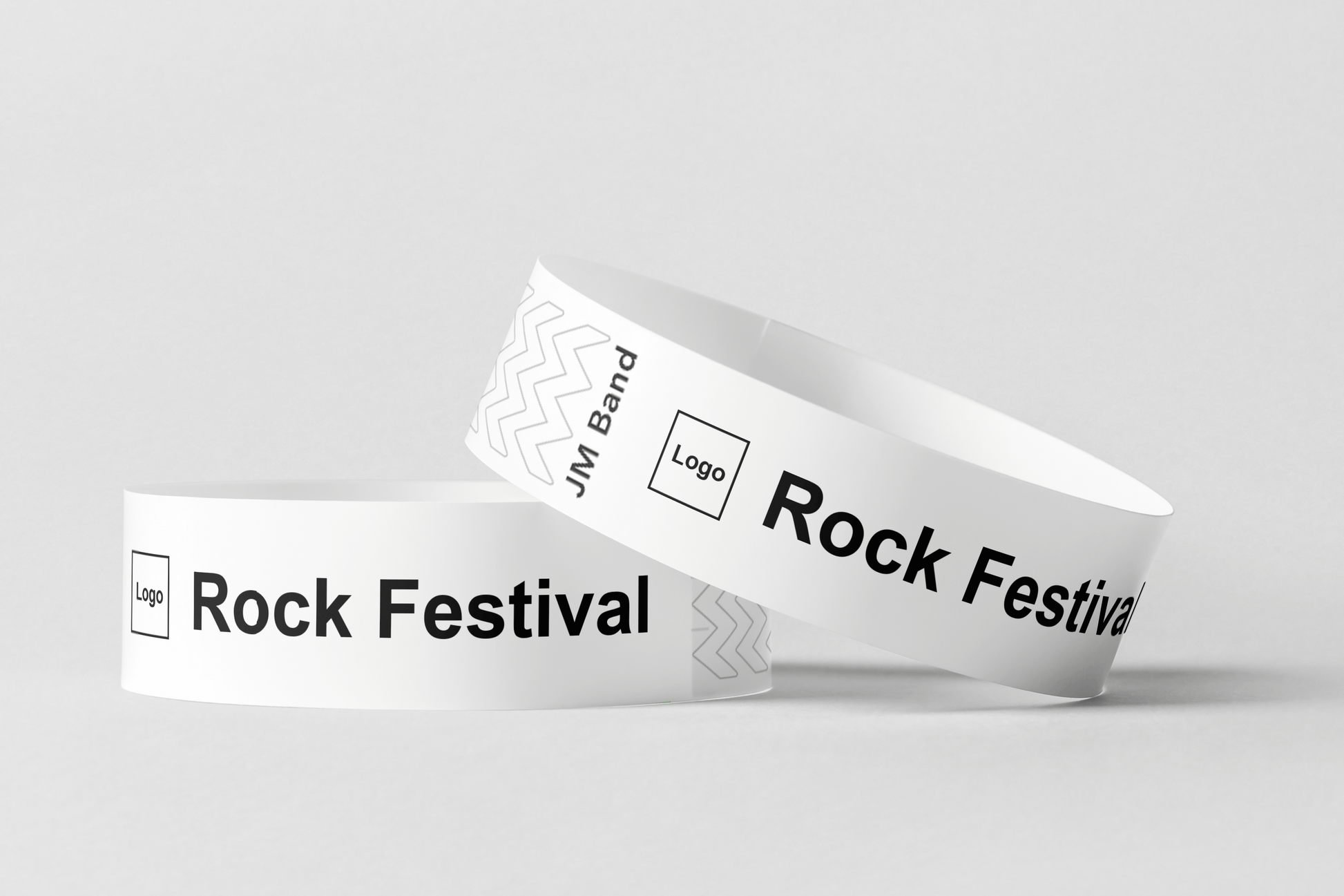 To Papirarmbånd med trykk Design selv armbånd fra JM Band NO med ordet rockefestival på.