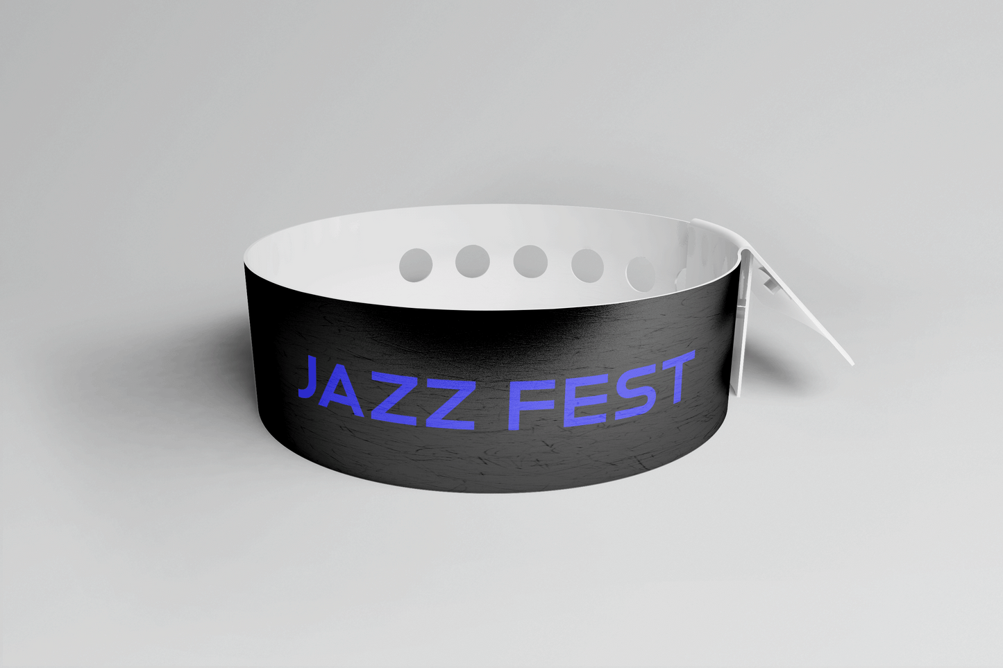 Et svart PVC-armbånd med ordet jazzfest på, Plastarmbånd L-print Design selv fra JM Band NO.