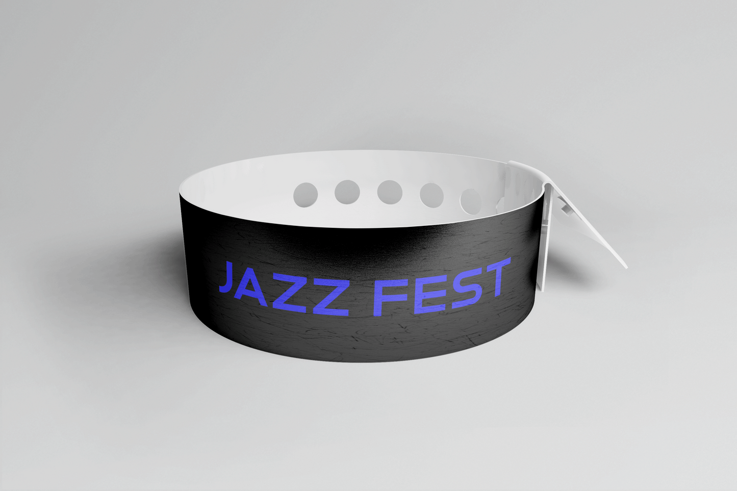 Et svart PVC-armbånd med ordet jazzfest på, Plastarmbånd L-print Design selv fra JM Band NO.