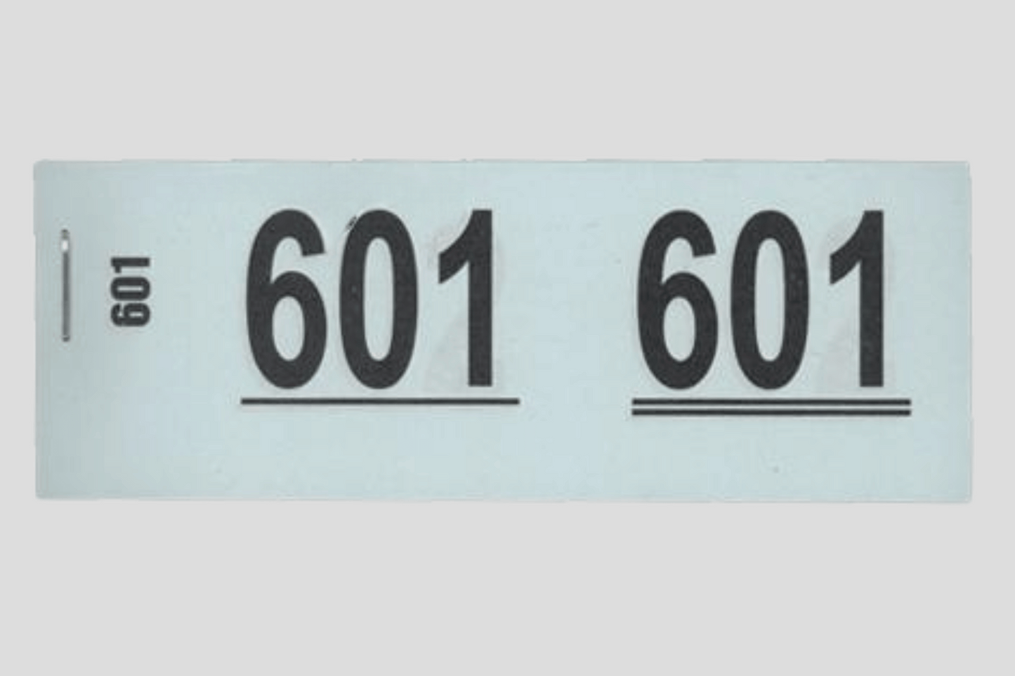 En etikett med nummeret 6011 på, vanligvis brukt for Garderobe billetter hæfter eller billetter. Alternativt kan den også brukes som JM Band NO.