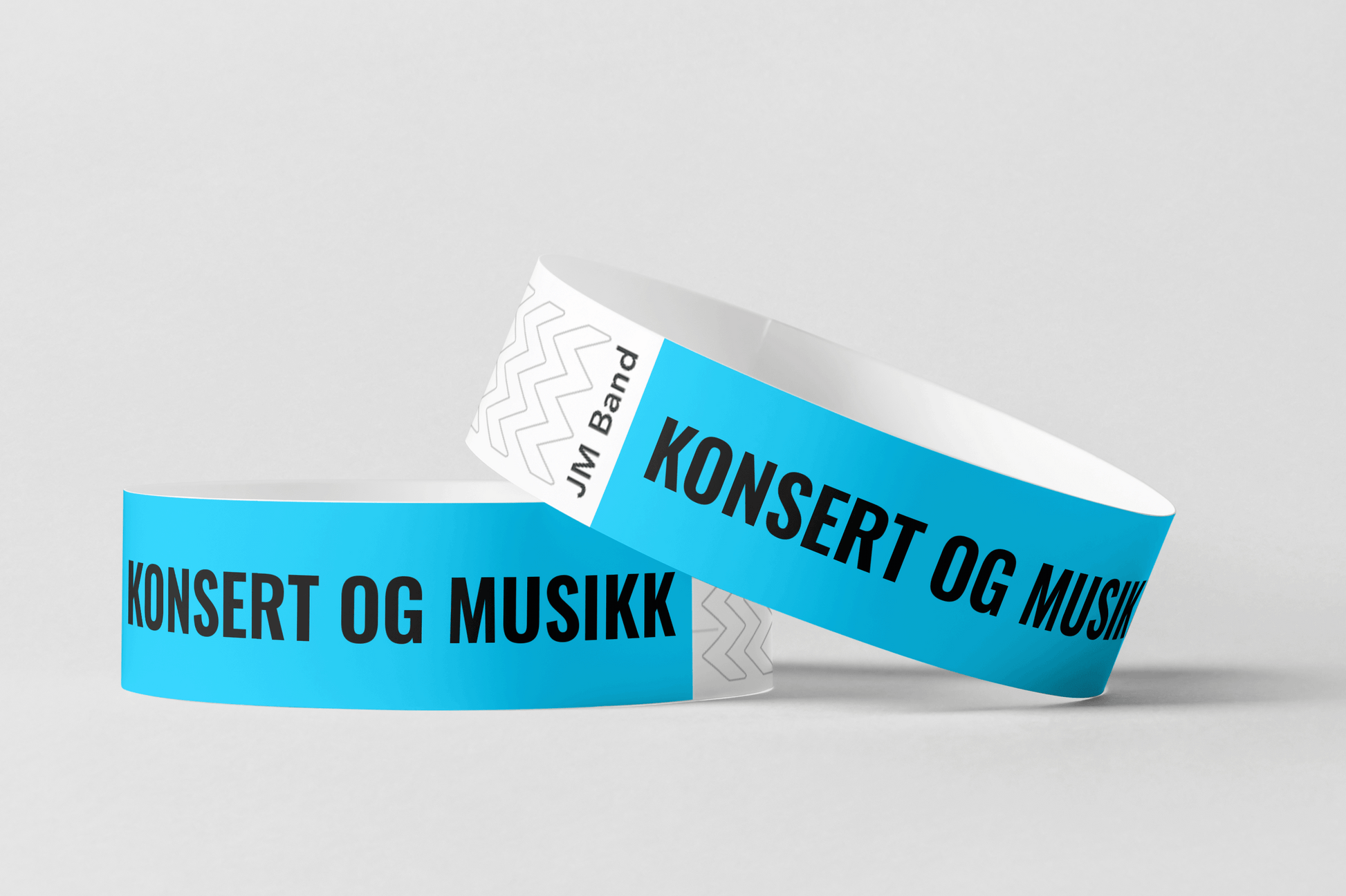 To papirarmbånd med trykk Via e-post fra JM Band NO som sier konsert og papirarmbånd.