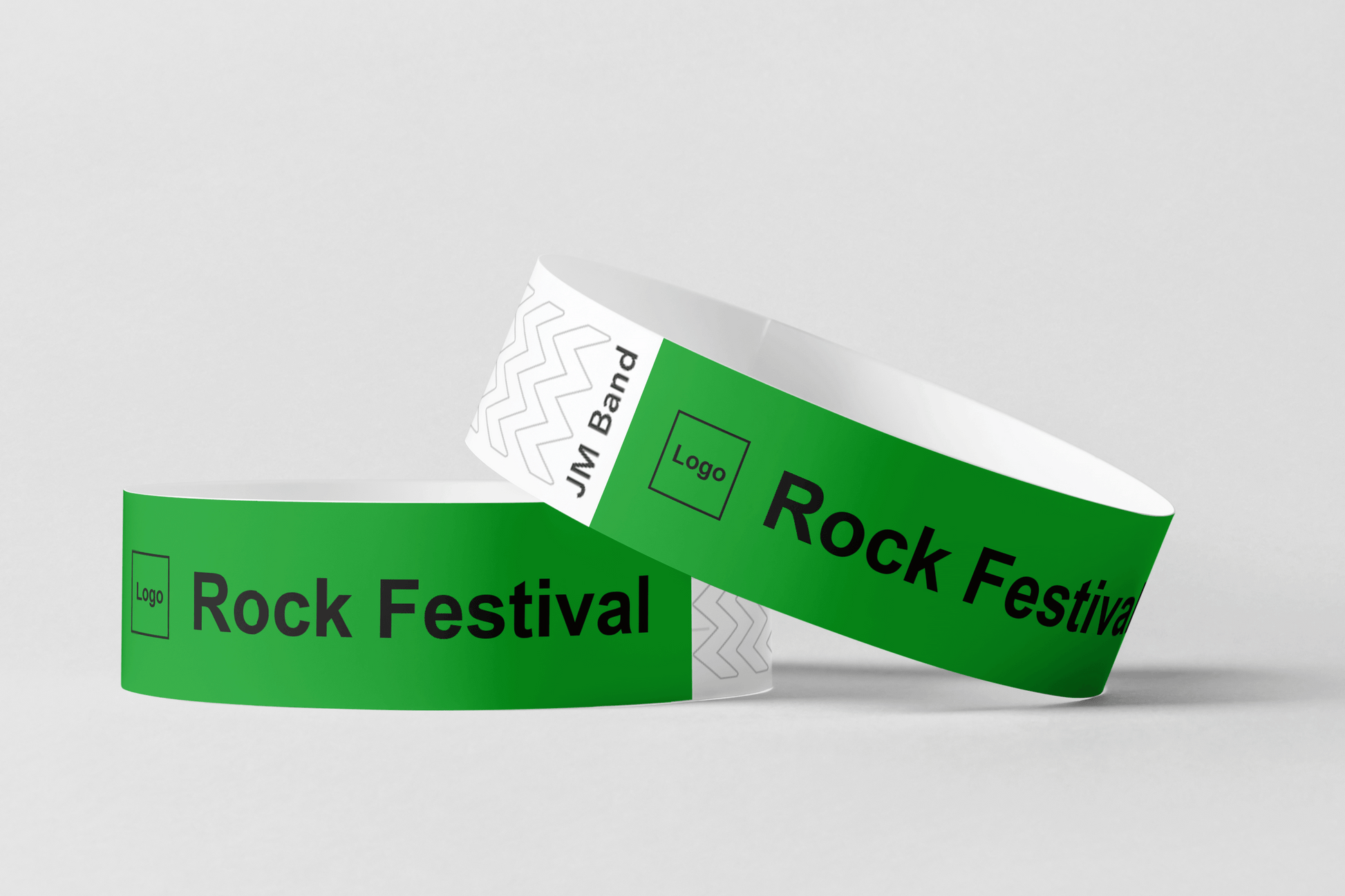 To armbånd med ordet rockefestival på, laget av JM Band NO Papirarmbånd med trykk Design selv og tyvek armbånd.