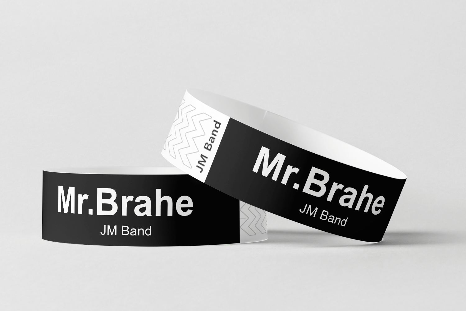 To sorte og hvite Papirarmbånd med hvit trykk Design selv armbånd med ordet mr brahe fra JM Band NO.