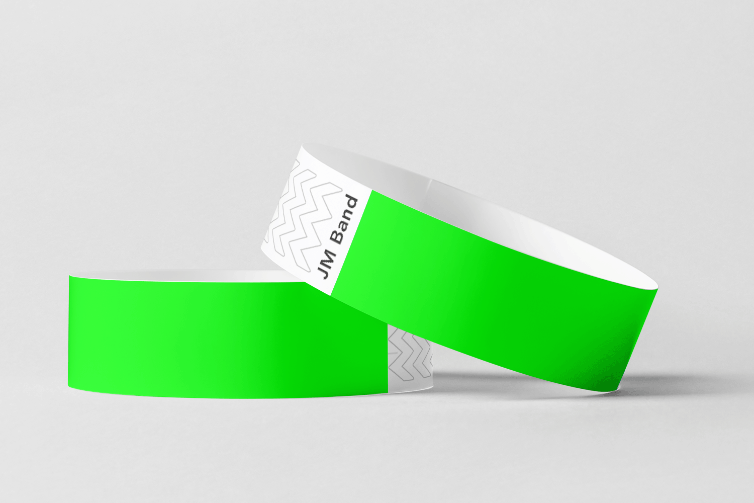 To grønne Papir armbånd uten trykk På lager, JM Band NO, på hvit bakgrunn.
